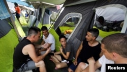 Migrantes cubanos en el refugio Senda de Vida, en Reynosa, México, en mayo de 2022. (REUTERS/Daniel Becerril/Archivo)