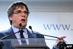 El líder catalán Carles Puigdemont durante una conferencia de prensa este jueves en Bruselas. (Photo by John Thys/AFP)