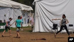 Refugiados ucranianos en México, el 24 de mayo de 2022. (AP Foto/Marco Ugarte).