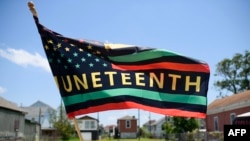 La primera festividad oficial de Juneteenth se produjo en 1980, cuando Texas lo declaró feriado estatal. (AFP/Mark Felix).